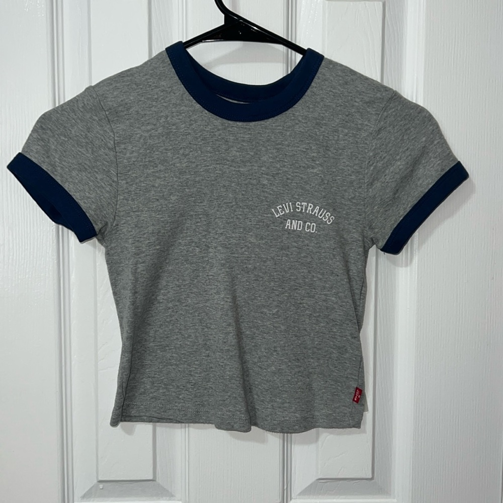 Gray Levi’s shirt blue lining the arms and neck